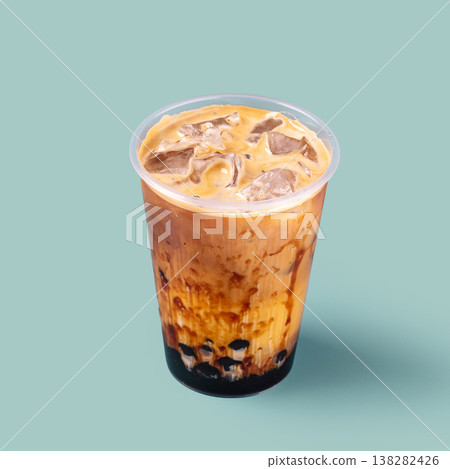 Iced milk tea with tapioca pearls in plastic cup Iced milk tea with tapioca pearls in plastic cup 138282426