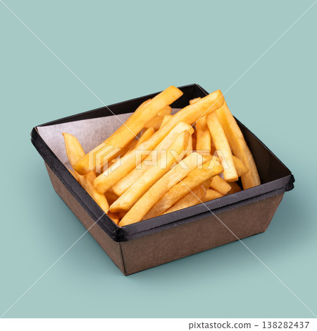 French fries in takeaway box on blue background French fries in takeaway box on blue background 138282437