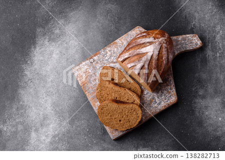 A loaf of homemade whole grain rye bread for the dinner table. A loaf of rye bread A loaf of homemade whole grain rye bread for the dinner table. A loaf of rye bread 138282713