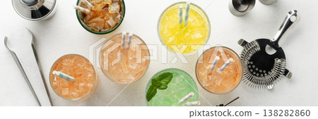 Cocktails and bartender tools on white background Cocktails and bartender tools on white background 138282860