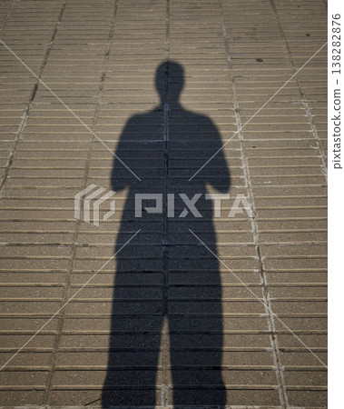 Contrasting Shadows Cast Onto Textured City Pavement And Tiles 138282876