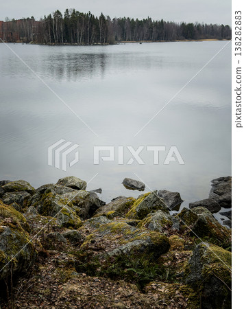 Tranquil Natural Landscape With Reflective Water And Lush Trees Tranquil Natural Landscape With Reflective Water And Lush Trees 138282883