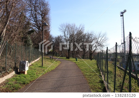 Sunny walking path in a public park in Castenedolo, Brescia, Italy Sunny walking path in a public park in Castenedolo, Brescia, Italy 138283120