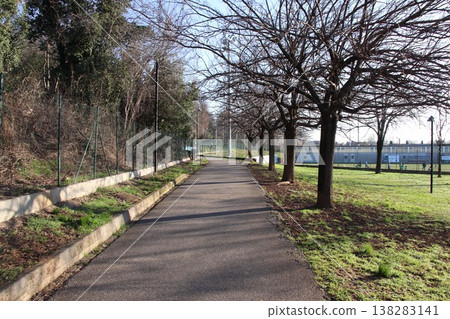 Sunny walking path in a public park in Castenedolo, Brescia, Italy Sunny walking path in a public park in Castenedolo, Brescia, Italy 138283141