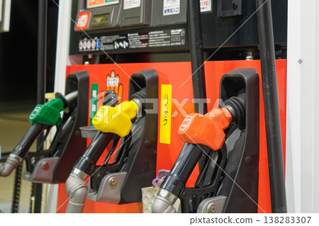 A close-up of three types of fuel nozzles that evoke images of rising gasoline prices and household budget protection. 138283307