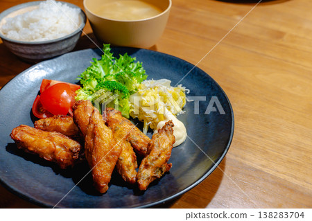 A hearty fried chicken set meal with salad. A hearty fried chicken set meal with salad. 138283704