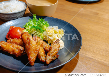 A plate of crispy fried chicken and salad. A plate of crispy fried chicken and salad. 138283705