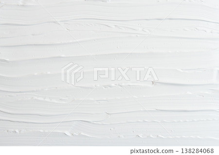 Close-up shot of the texture of spread white acrylic paint 11 138284068