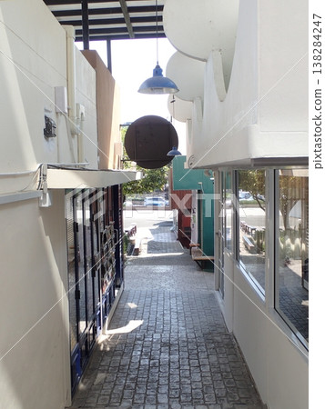 Narrow alleys abroad, quiet paths between cobblestone streets and buildings. 138284247