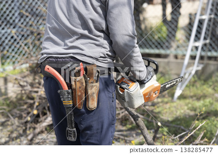 A gardener who prunes garden trees A gardener who prunes garden trees 138285477