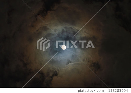 A hazy moon shines in the winter night sky 02 A hazy moon shines in the winter night sky 02 138285994