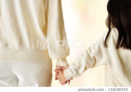 Mother and daughter connecting hands 138286393