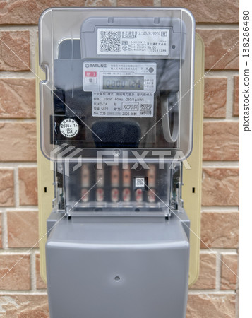 A new, next-generation electric meter mounted on the wall. A new, next-generation electric meter mounted on the wall. 138286480