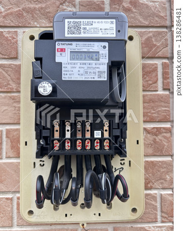 A new, next-generation electric meter mounted on the wall. A new, next-generation electric meter mounted on the wall. 138286481