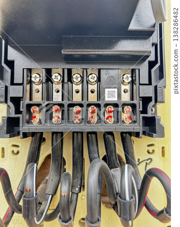 A new, next-generation electric meter mounted on the wall. A new, next-generation electric meter mounted on the wall. 138286482