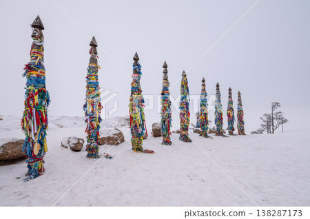 Snowing at Shaman poles located at cape Burkhan on Olkhon island in Lake Baikal, Russia. The poles represent the 13 deities of the island. Snowing at Shaman poles located at cape Burkhan on Olkhon island in Lake Baikal, Russia. The poles represent the 13 deities of the island. 138287173
