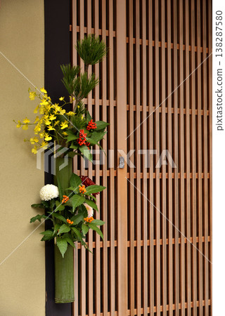 New Year's decorations at the entrance of a traditional townhouse New Year's decorations at the entrance of a traditional townhouse 138287580