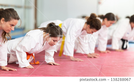 Women doing push-ups in training 138288067
