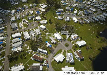 Badly damaged mobile homes after hurricane Ian in Florida residential area. Consequences of natural disaster Badly damaged mobile homes after hurricane Ian in Florida residential area. Consequences of natural disaster 138288184