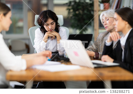 Tired female colleagues feeling tired during a long workday Tired female colleagues feeling tired during a long workday 138288271