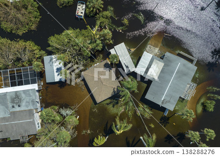 Aftermath of natural disaster. Surrounded by hurricane Ian rainfall flood waters homes in Florida residential area 138288276