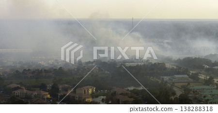 Aerial view of strong wildfire burning severely in North Port city, Florida. Natural disaster during dry season in jungle woods Aerial view of strong wildfire burning severely in North Port city, Florida. Natural disaster during dry season in jungle woods 138288318