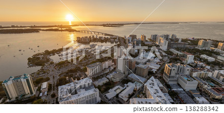 Aerial view of Sarasota city downtown at sunset with bay marina yachts and high-rise office buildings. Real estate development in Florida. USA travel destination 138288342