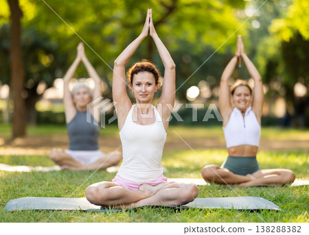 Adult woman doing yoga in lotus position 138288382