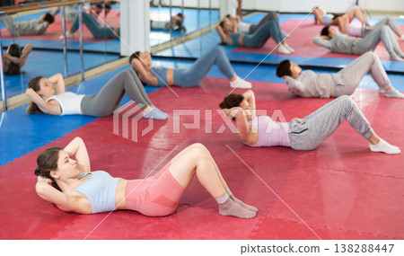 Group of women training abs in gym 138288447