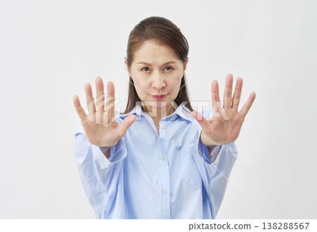 Elderly woman stopping on white background Elderly woman stopping on white background 138288567