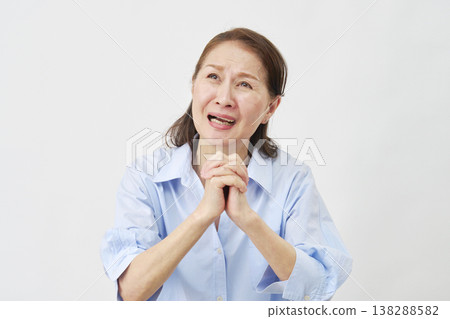 Elderly woman begging on white background Elderly woman begging on white background 138288582