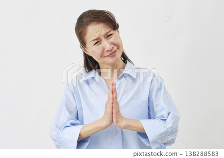 Elderly woman begging on white background Elderly woman begging on white background 138288583