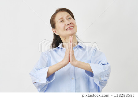Elderly woman begging on white background Elderly woman begging on white background 138288585
