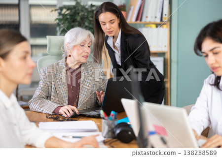Young woman helping elderly woman with laptop Young woman helping elderly woman with laptop 138288589