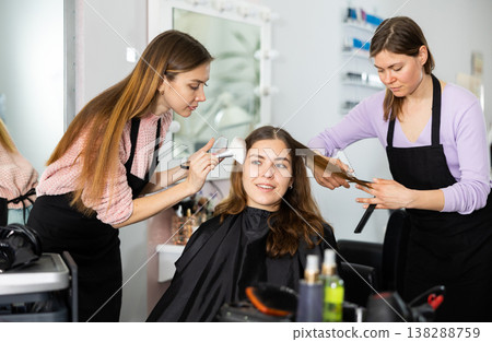 Young girl getting hairstyling and makeup in beauty salon 138288759