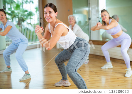Group are practising arch movement in step jazz dance in fitness gym 138289023