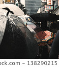 The everyday lives of people walking down Takeshita Street in the rain with umbrellas in hand. 138290215