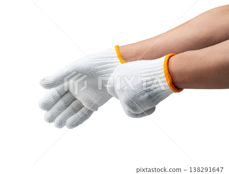 A pair of hands wearing white work gloves against a white background. 138291647