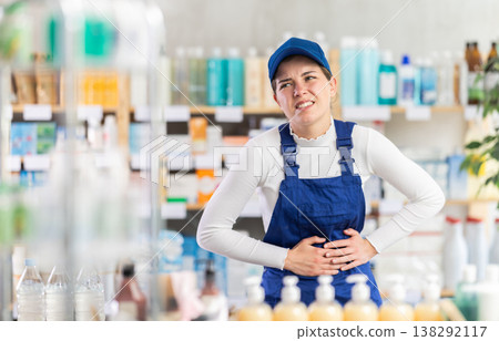 Young woman builder visits pharmacy and suffers from stomach pain Young woman builder visits pharmacy and suffers from stomach pain 138292117