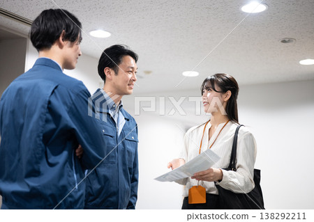 A woman and a worker talking 138292211