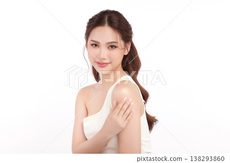 A beautiful young Asian woman with clean, fresh skin against a white background. Skincare, facial treatment, cosmetology, beauty, and spa. An elegant portrait of an Asian woman. A beautiful young Asian woman with clean, fresh skin against a white background. Skincare, facial treatment, cosmetology, beauty, and spa. An elegant portrait of an Asian woman. 138293860