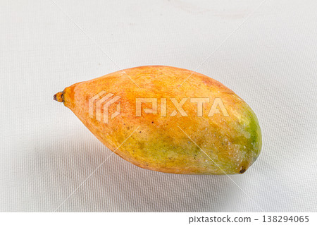 Two ripe tropical mango fruits on a rustic background Two ripe tropical mango fruits on a rustic background 138294065
