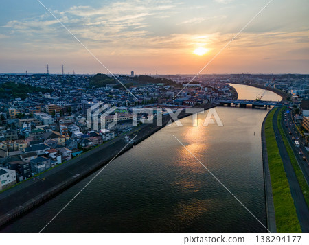Drone footage of the Tsurumi River at dusk. To the west lies Tsurumi Ward in Yokohama City, and to the east are Kawasaki Ward and Saiwai Ward in Kawasaki City. This is a survey conducted before river construction work. Drone footage of the Tsurumi River at dusk. To the west lies Tsurumi Ward in Yokohama City, and to the east are Kawasaki Ward and Saiwai Ward in Kawasaki City. This is a survey conducted before river construction work. 138294177