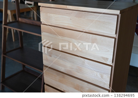 A chest of natural wood that showcases the beautiful wood grain. 138294695
