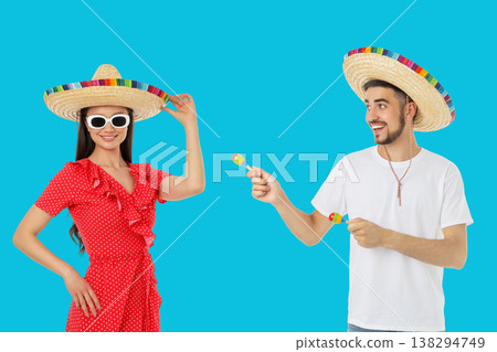 Couple celebrates Cinco de Mayo in sombreros Couple celebrates Cinco de Mayo in sombreros 138294749