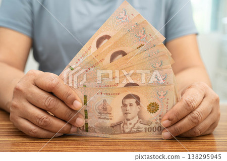 Asian woman counting Thai baht banknote money, investment economy, accounting business and banking. 138295945