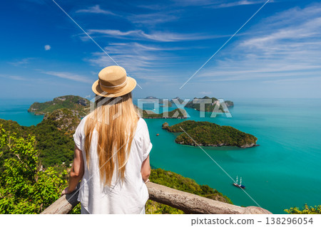 Woman at viewpoint in Ang Thong Marine National Park overlooking tropical islands and turquoise sea in Thailand 138296054