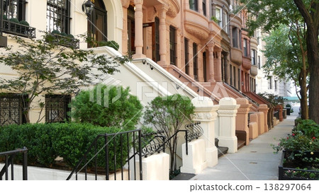 New York City townhouse buildings, residential brownstone row houses in Manhattan or Brooklyn, USA. 138297064