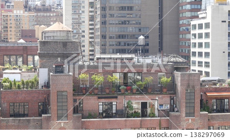 New York City Midtown East urban residential buildings, Manhattan rooftop, USA. Water towers on roof 138297069