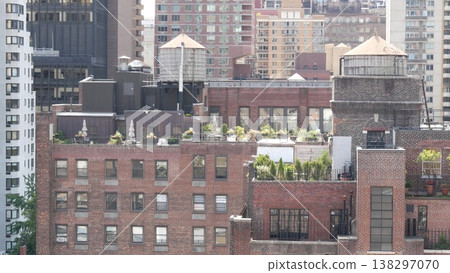 New York City Midtown East urban residential buildings, Manhattan rooftop, USA. Water towers on roof 138297070